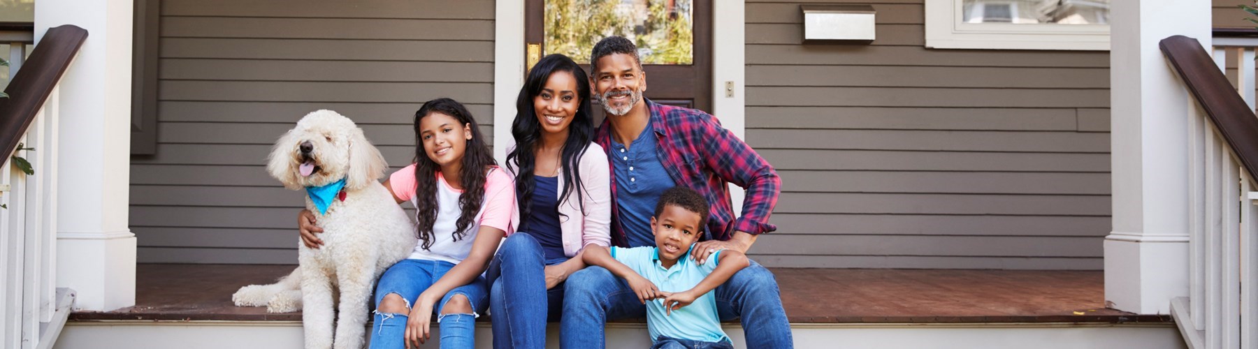 Beautiful family with two children and a dog